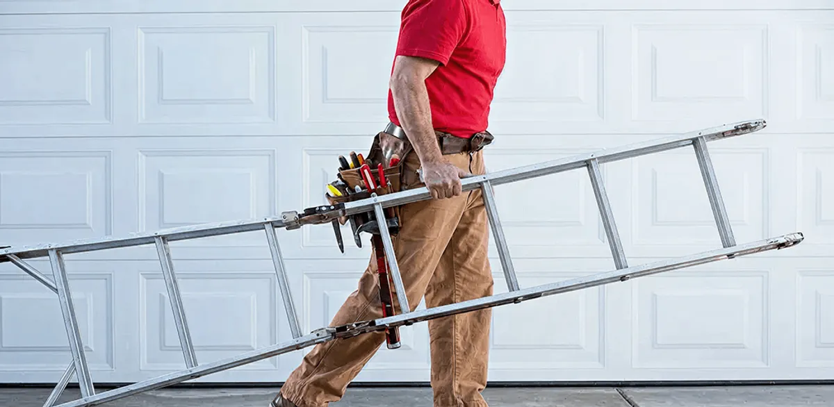 Garage door repair technician arriving with tools and ladder in Stamford, CT