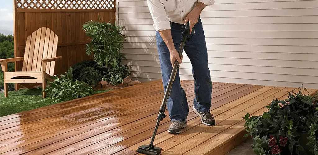Deck staining service applying stain to a backyard wood deck in Stamford, CT